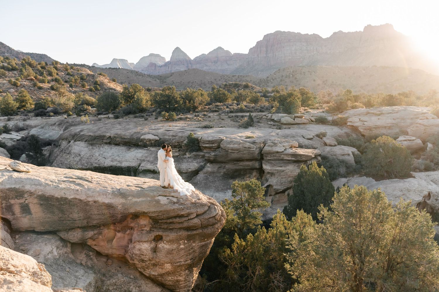 Zion Adventure Session. Panoramic view of red rock formations and desert landscape at sunset in Utah's scenic canyon country.