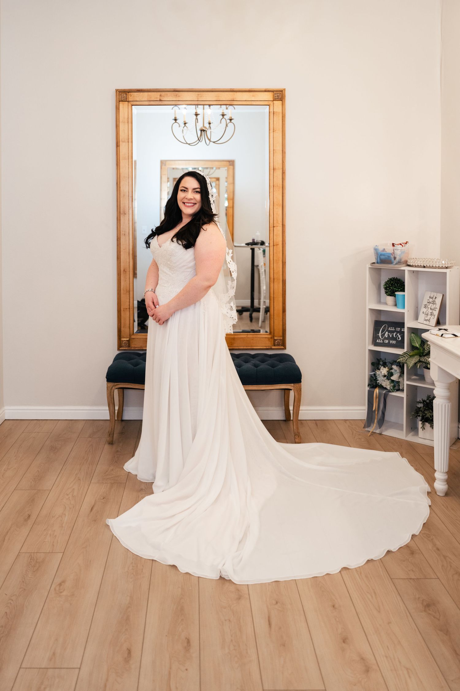 A wedding dress photo series showing the flowing train and silhouette at Alpine Art Center. Utah County Wedding Venue.