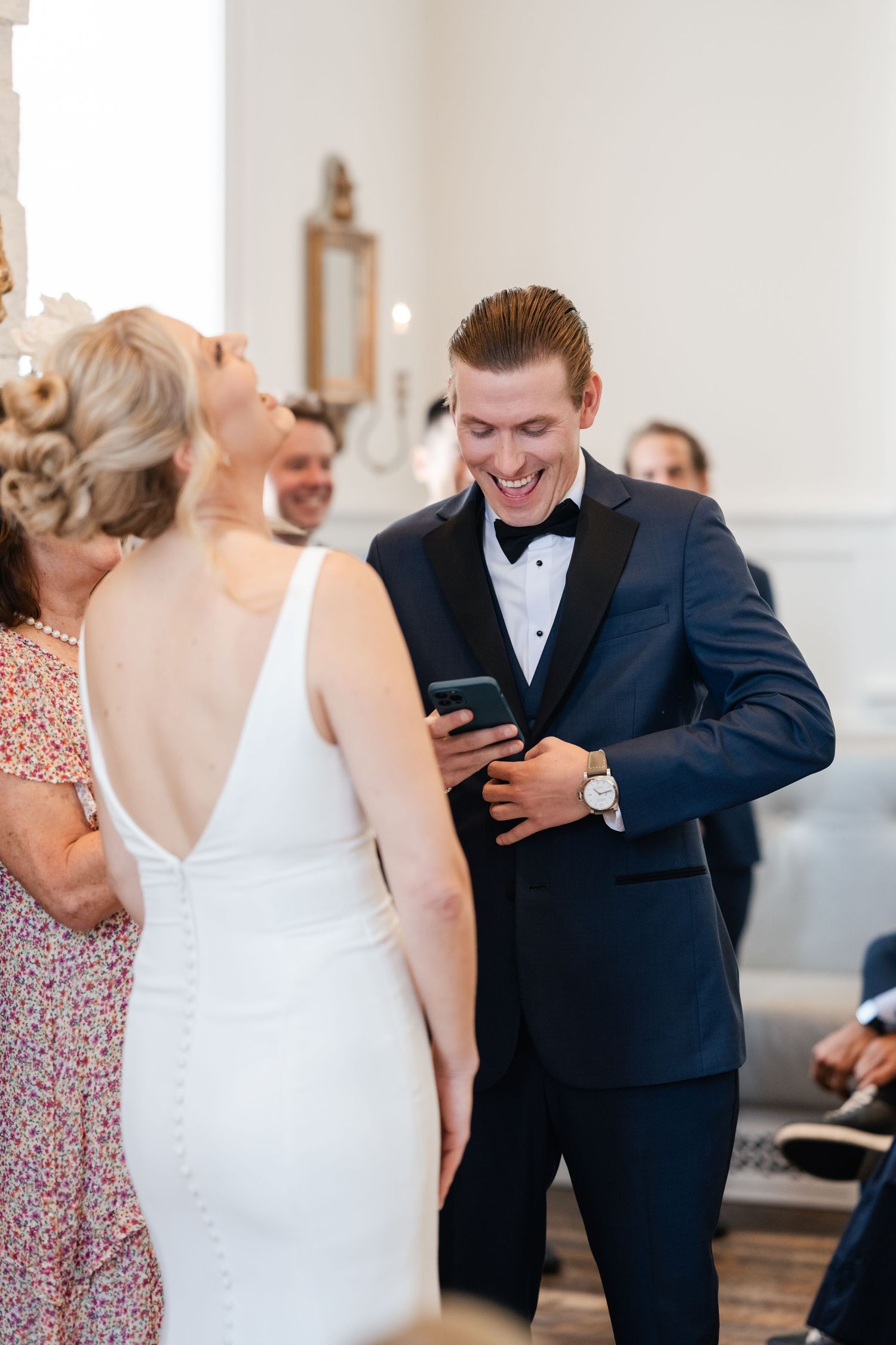 Wedding celebration candid shots capturing joyful moments between a couple in formal attire.