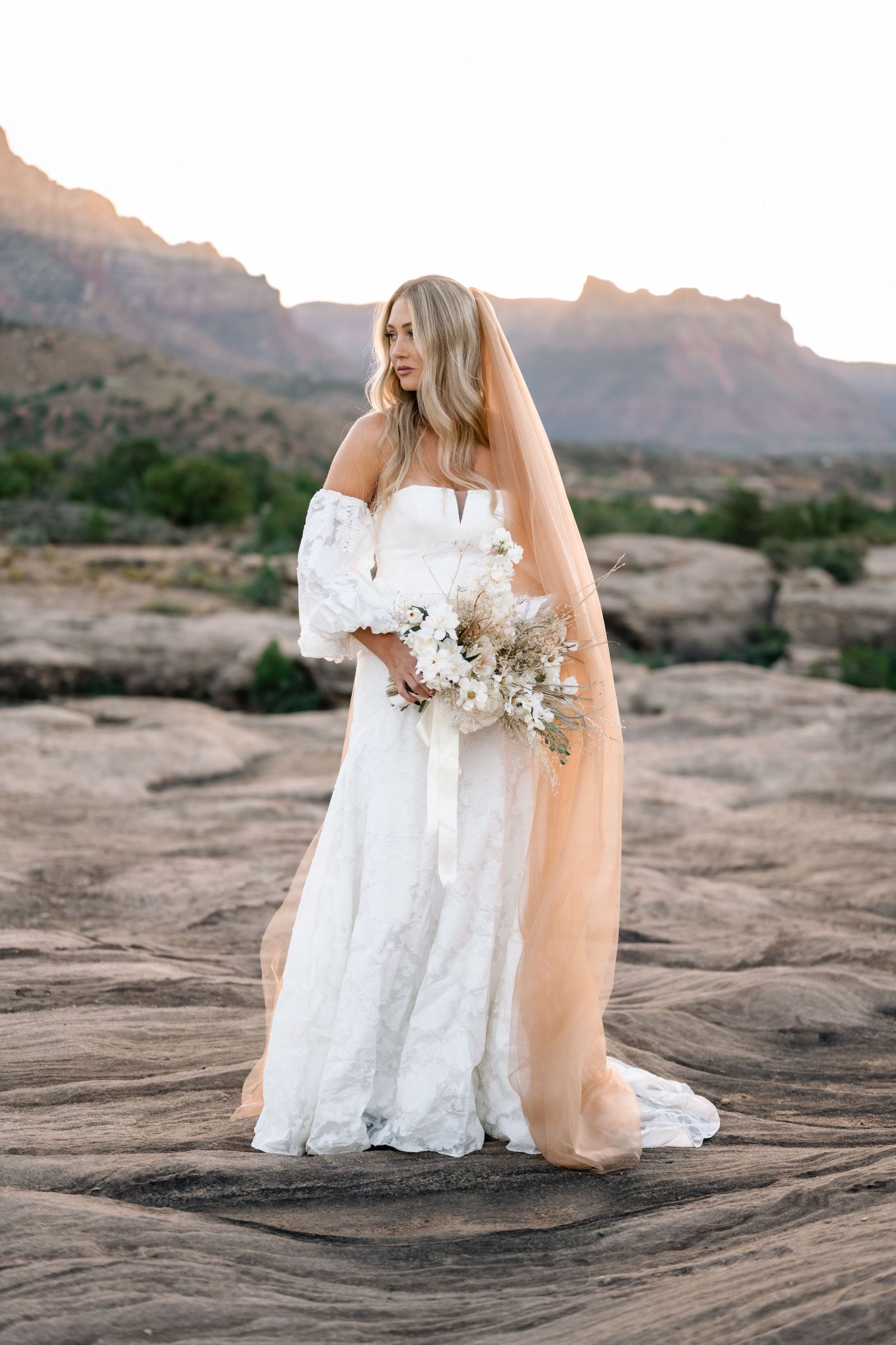 Ethereal desert sunrise bridal photoshoot captured by a Utah elopement photographer
