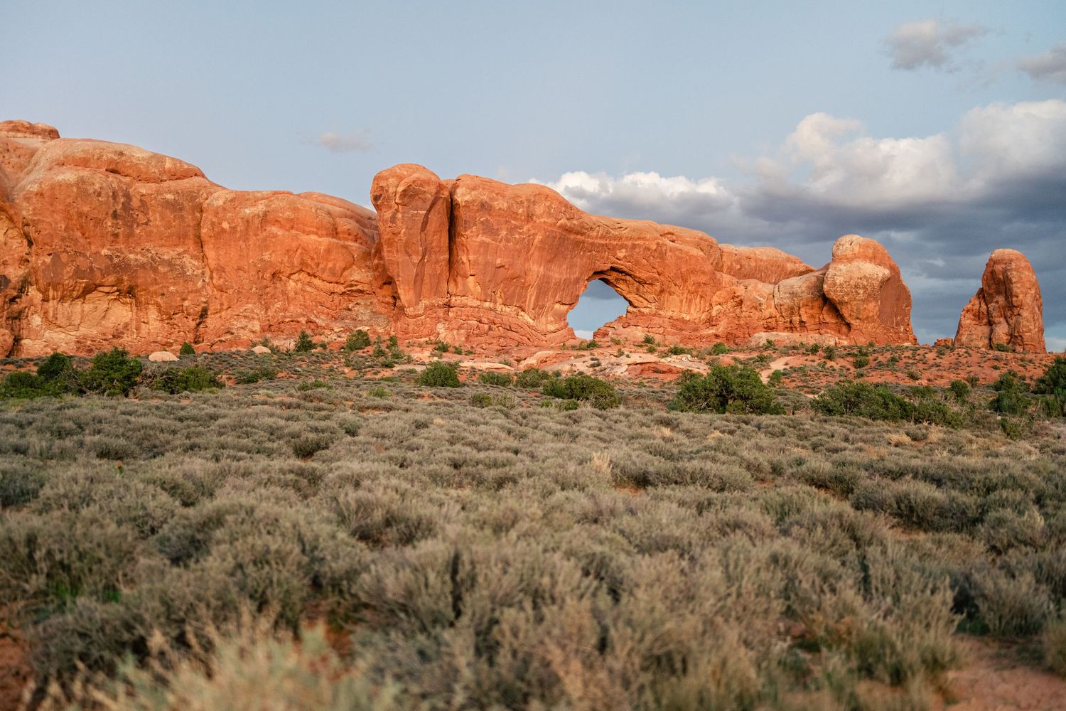 Landscape image of the windows at Arches National Park at sunset