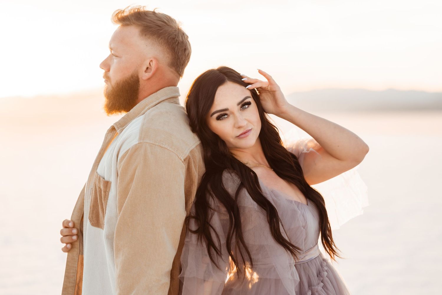 Salt Flats photos of a couple during sunset by Utah engagements photographer