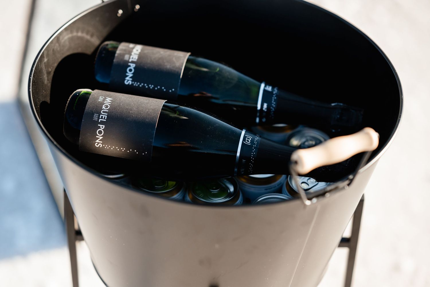 Champagne bottles chilling in an ice bucket.