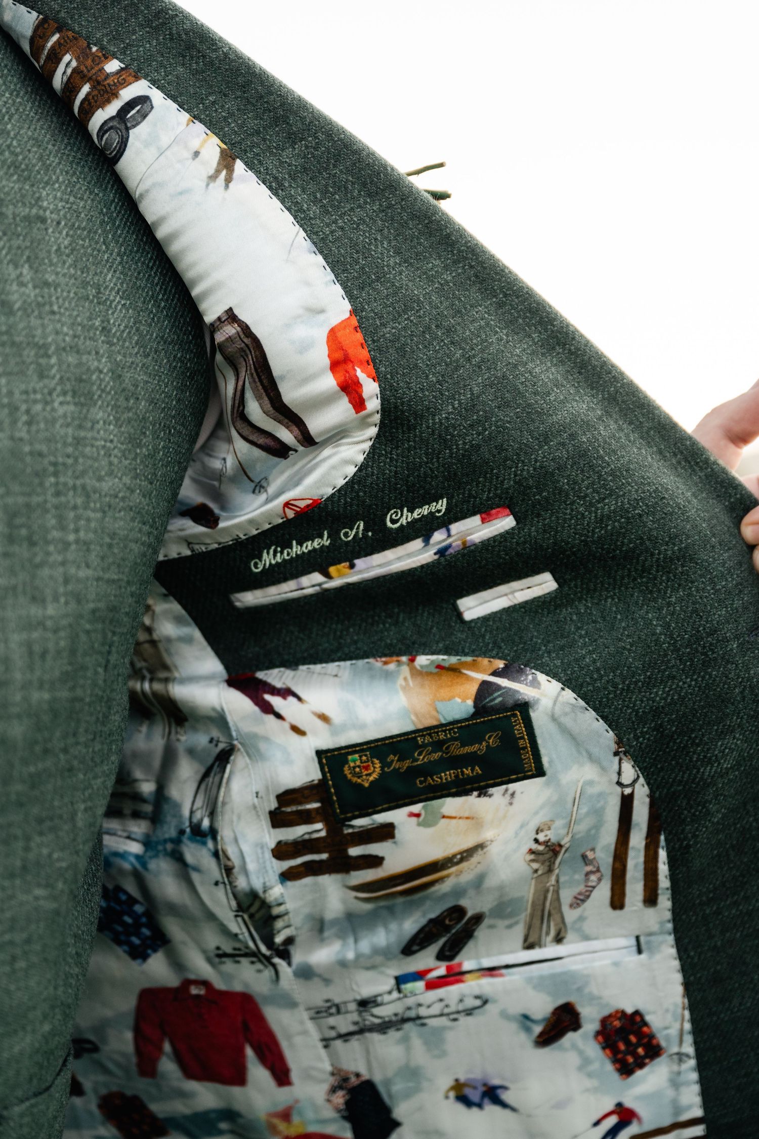 Detail shot of suit jacket lining with custom printed pattern.