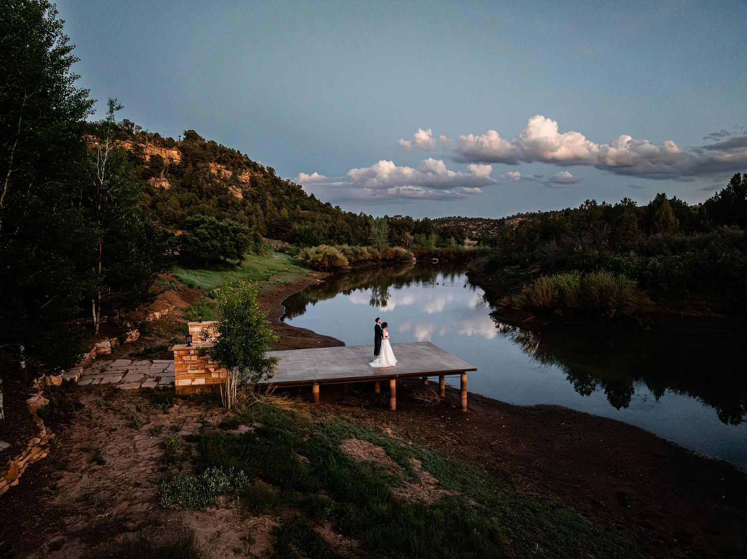 Series of lakeside landscape photos showing reflective water, mountains, and a rustic cabin at sunset.
