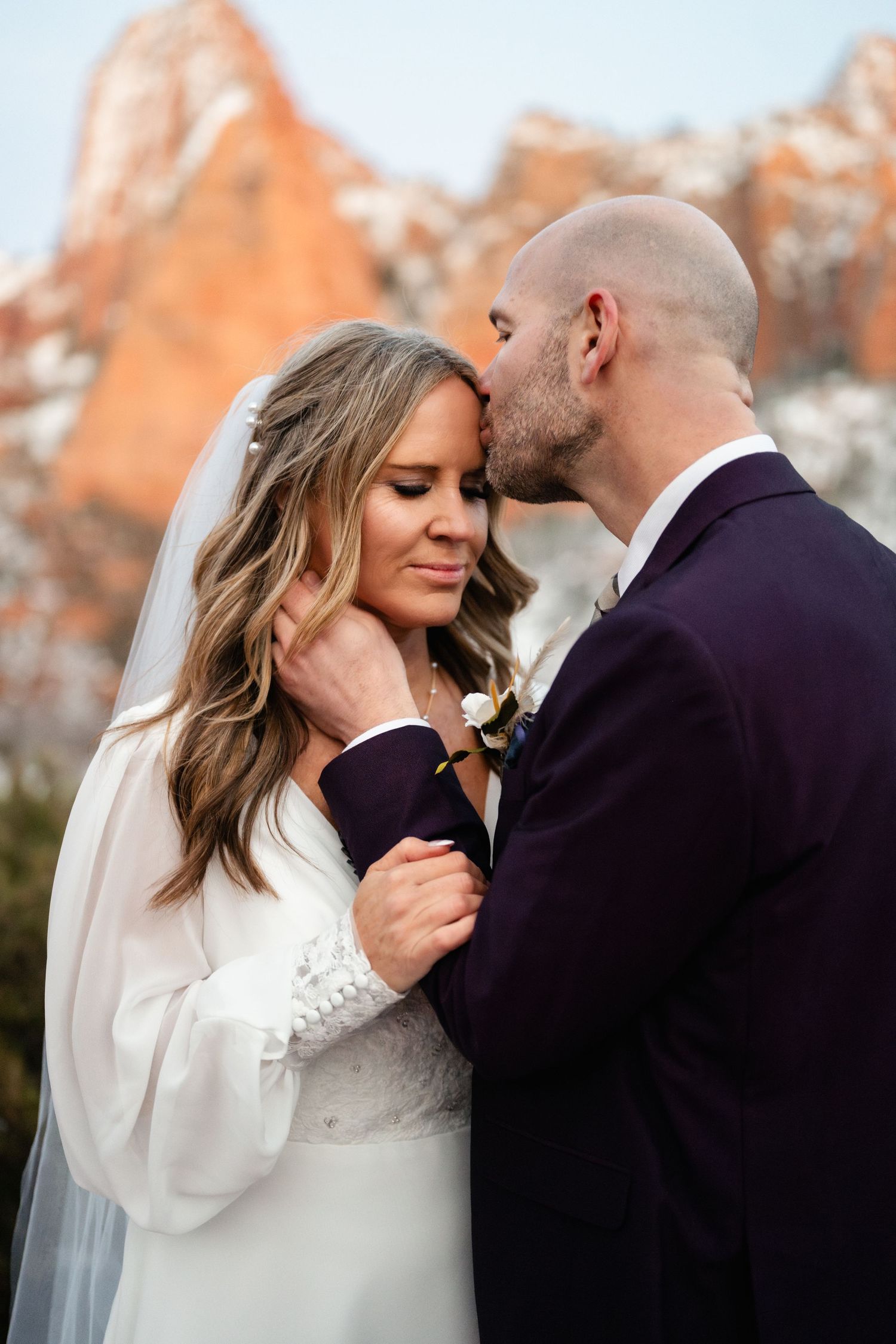 A romantic sequence of wedding photos showing a couple in winter sharing intimate moments in their formal attire.