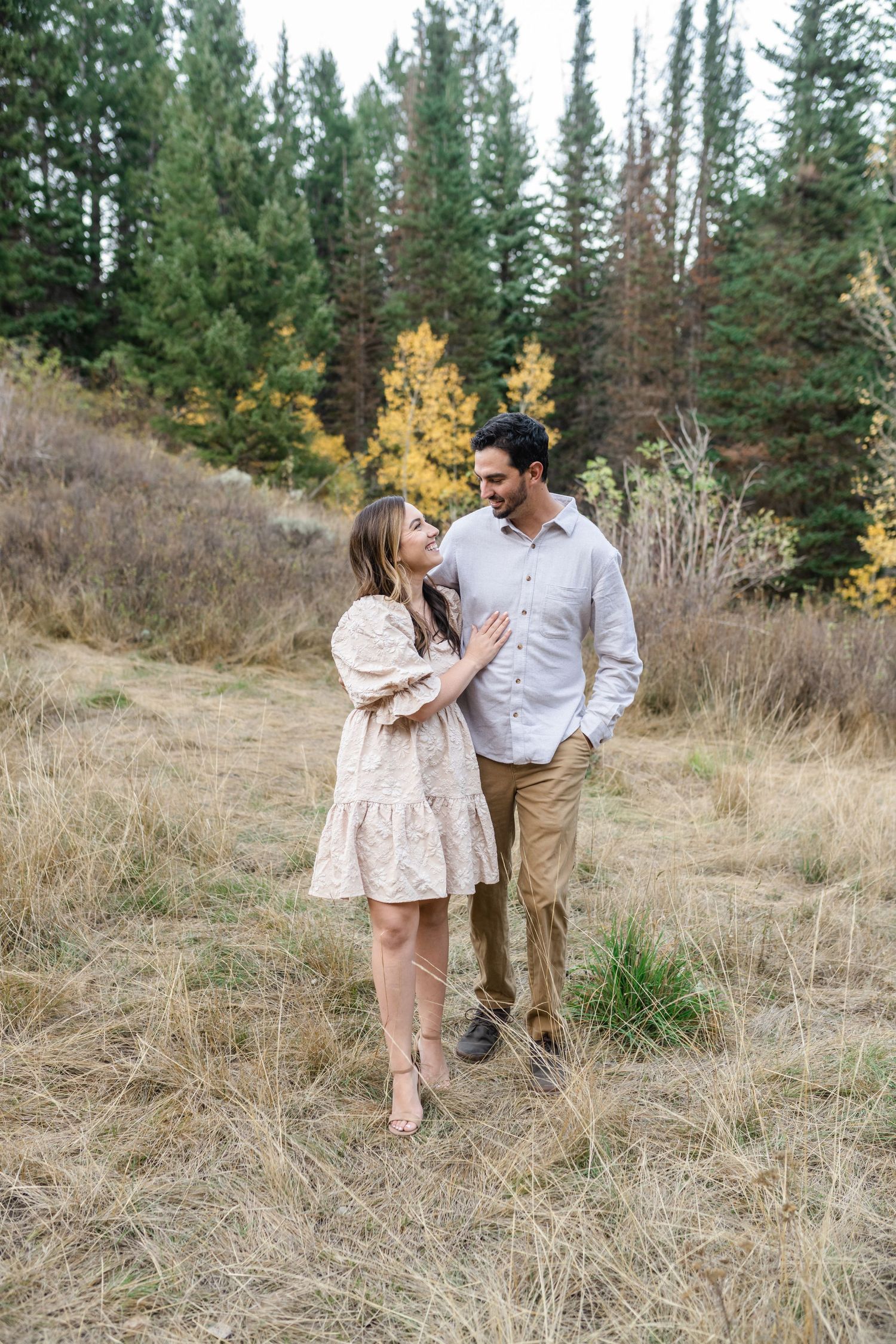 husband and wife looking into each others eyes during their family session in American Fork Canyon