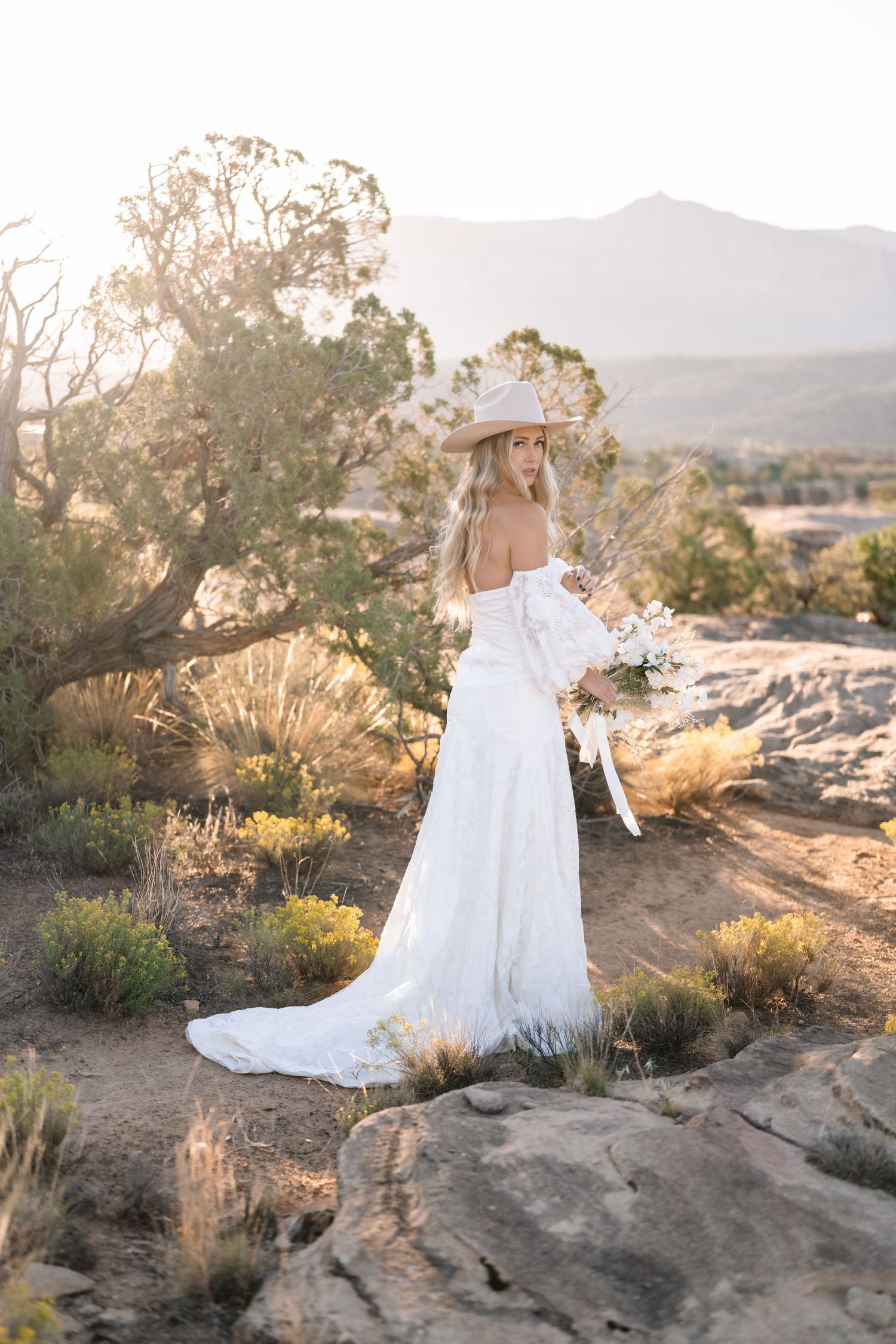 Ethereal desert sunrise bridal photoshoot captured by a Utah elopement photographer