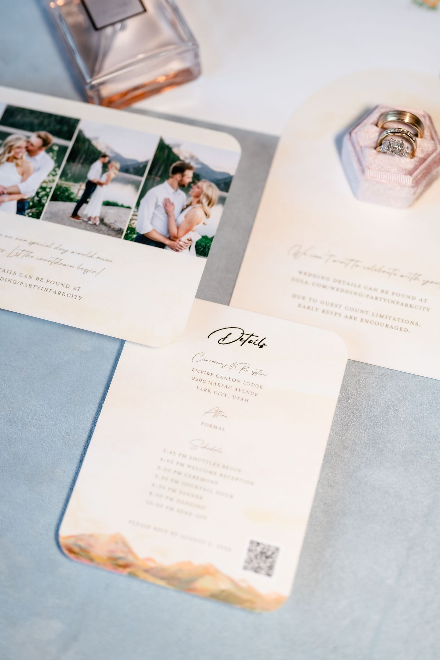 Wedding stationery and invitation suite laid out on light blue background.