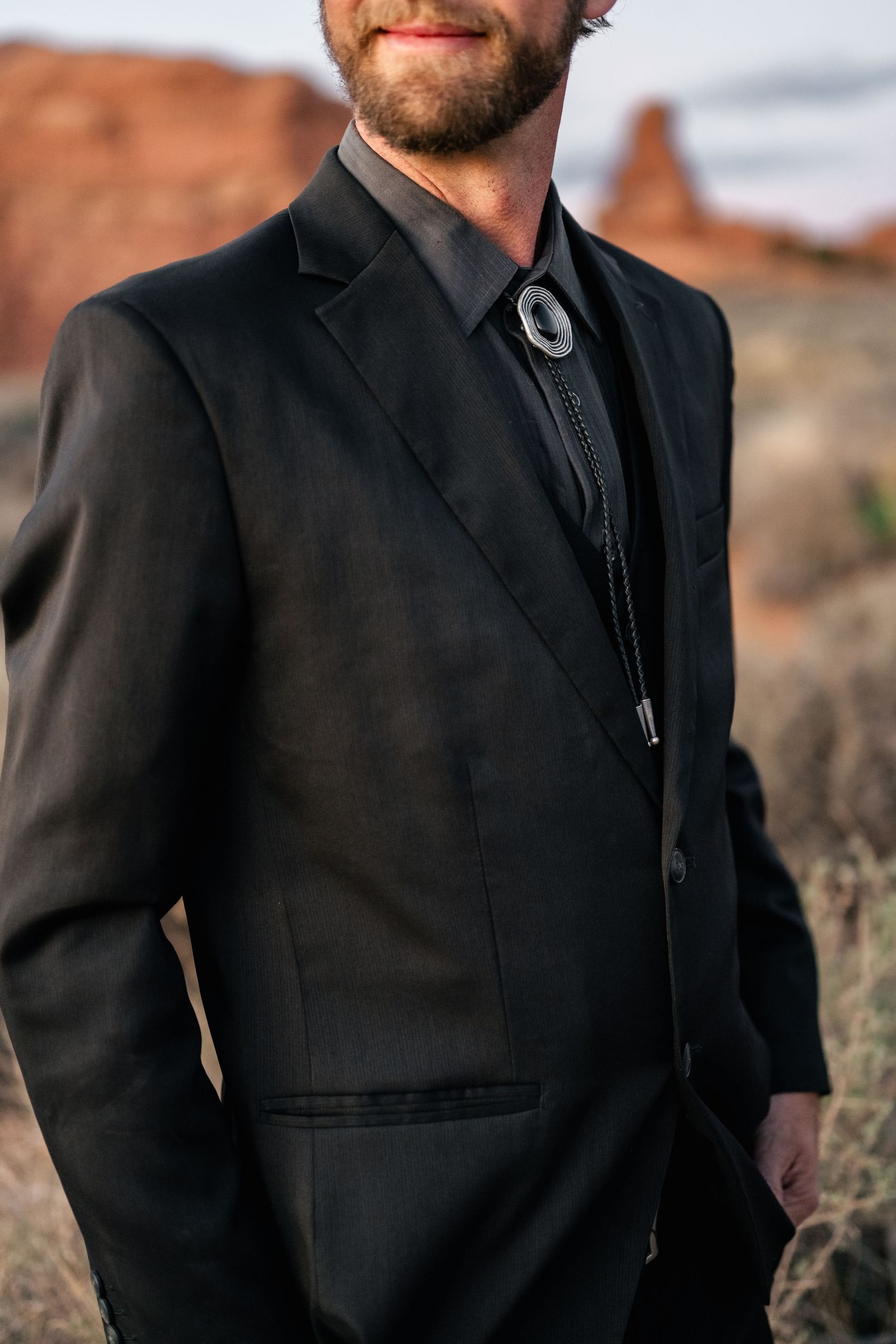 Groom detail portrait during Arches National Park Elopement by Utah elopement photographer and videographer