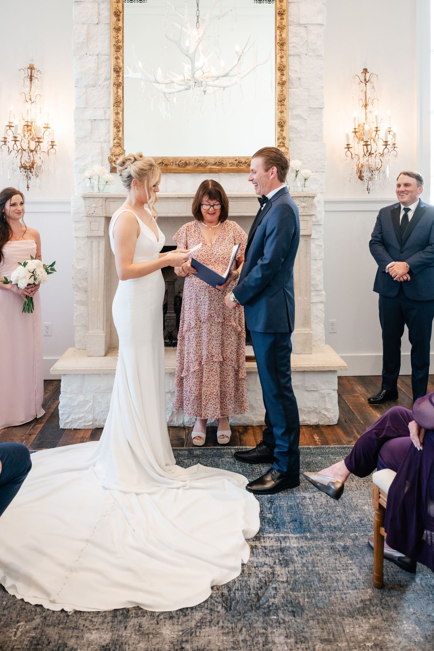 Wedding ceremony sequence showing interactions between wedding party members in an elegant white venue.