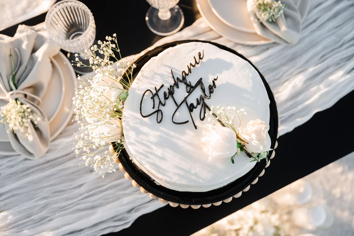 Wedding place settings with delicate details and romantic lighting create an intimate atmosphere.
