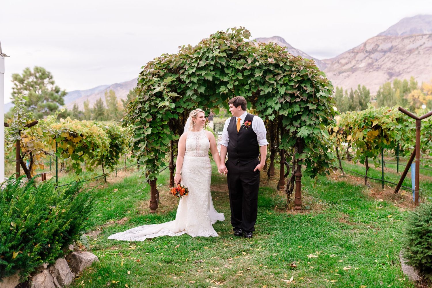 Utah county venues with mountain views and beautiful gardens. Couple in the vineyard at Wadley Farms Venue by Coley Cook, Utah Wedding Photo