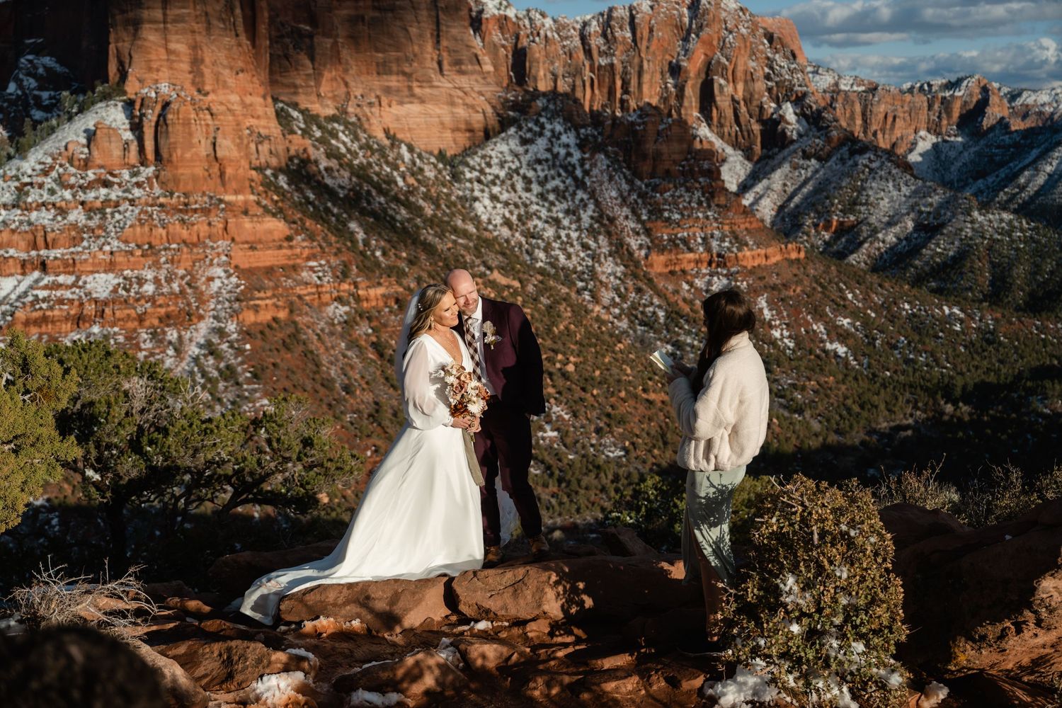 Snow-covered red rock formations create a dramatic backdrop in Zion National Park.