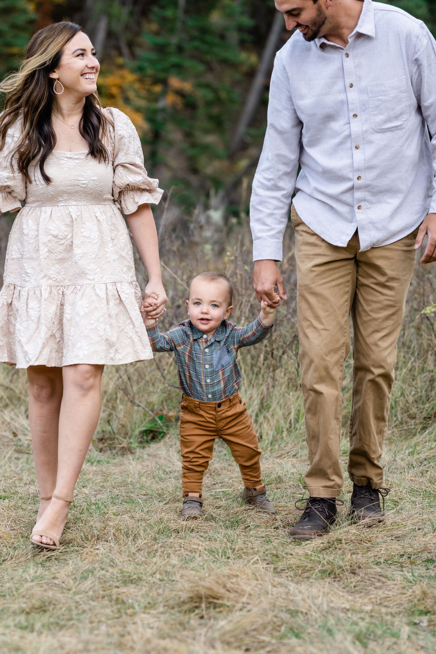Family photos walking and holding baby's hands by Utah Family Photographer.