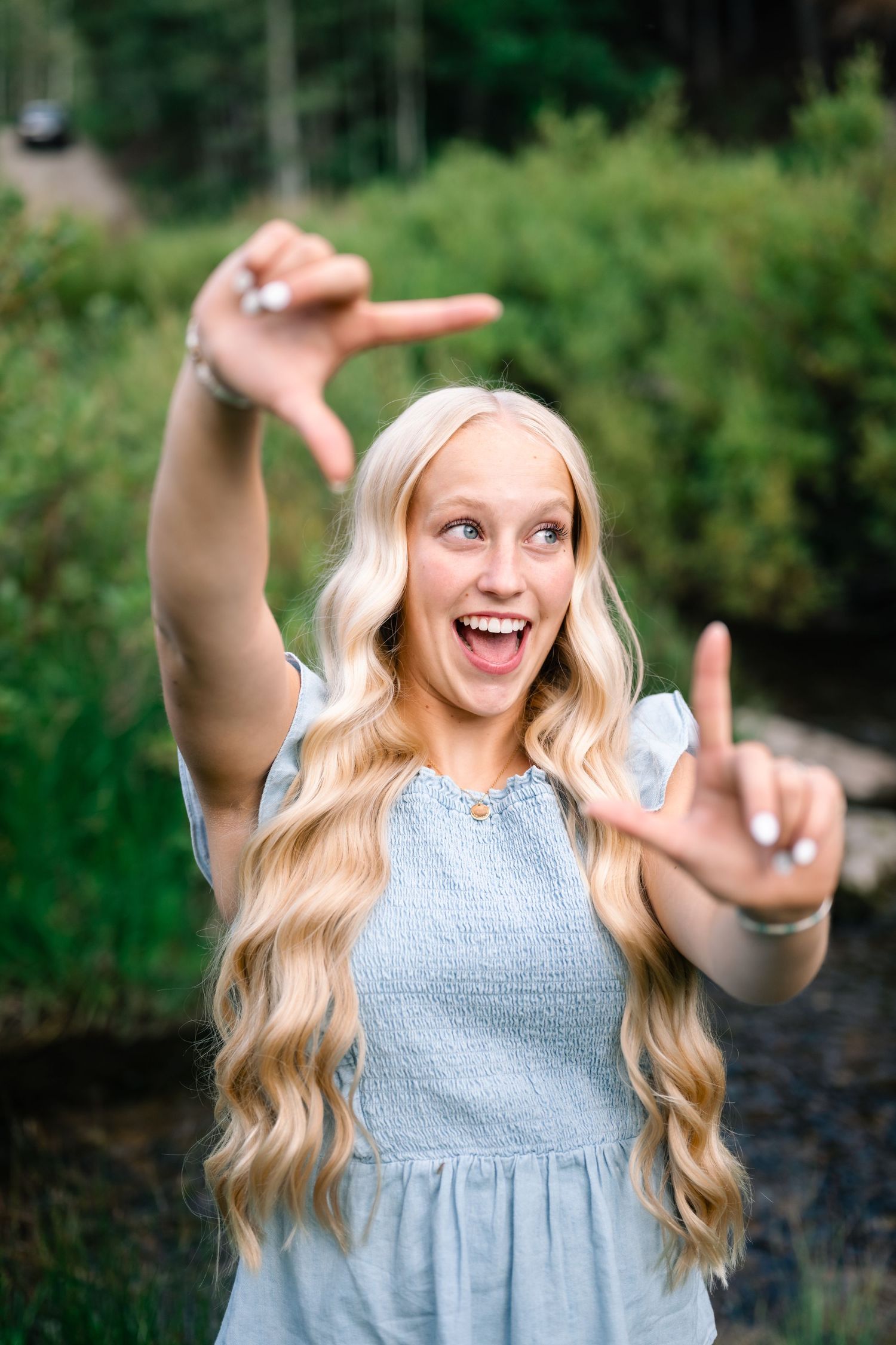 fun and playful senior portrait during her senior session in the mountains