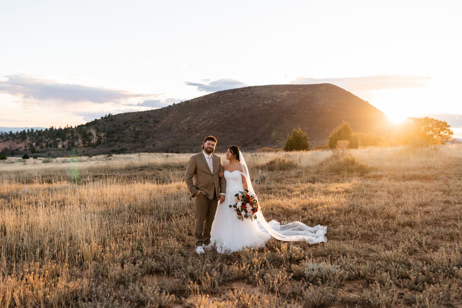 Golden hour wedding photography in a scenic mountain landscape.