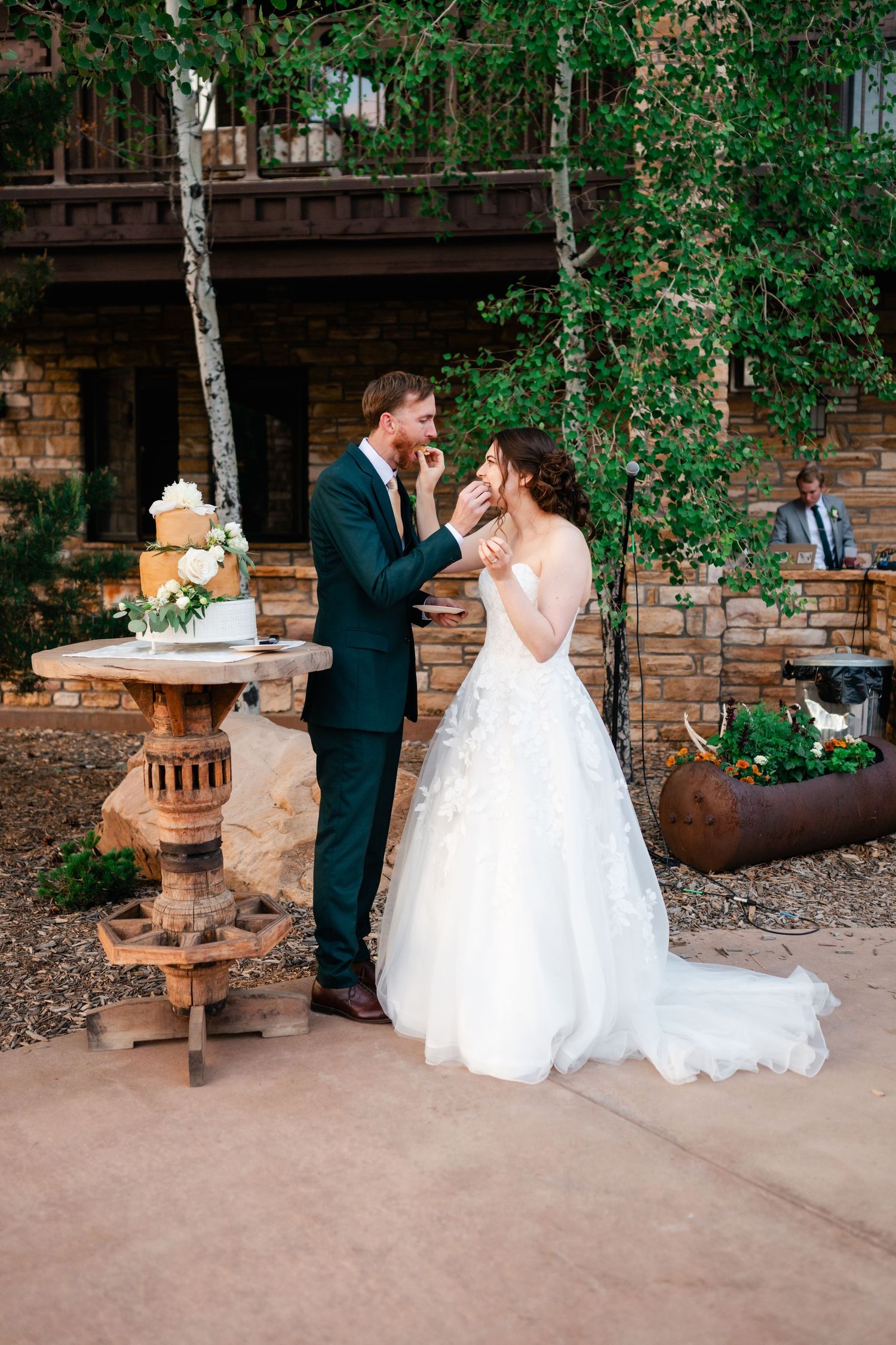 A romantic dance sequence captured in multiple frames against a rustic outdoor venue setting.