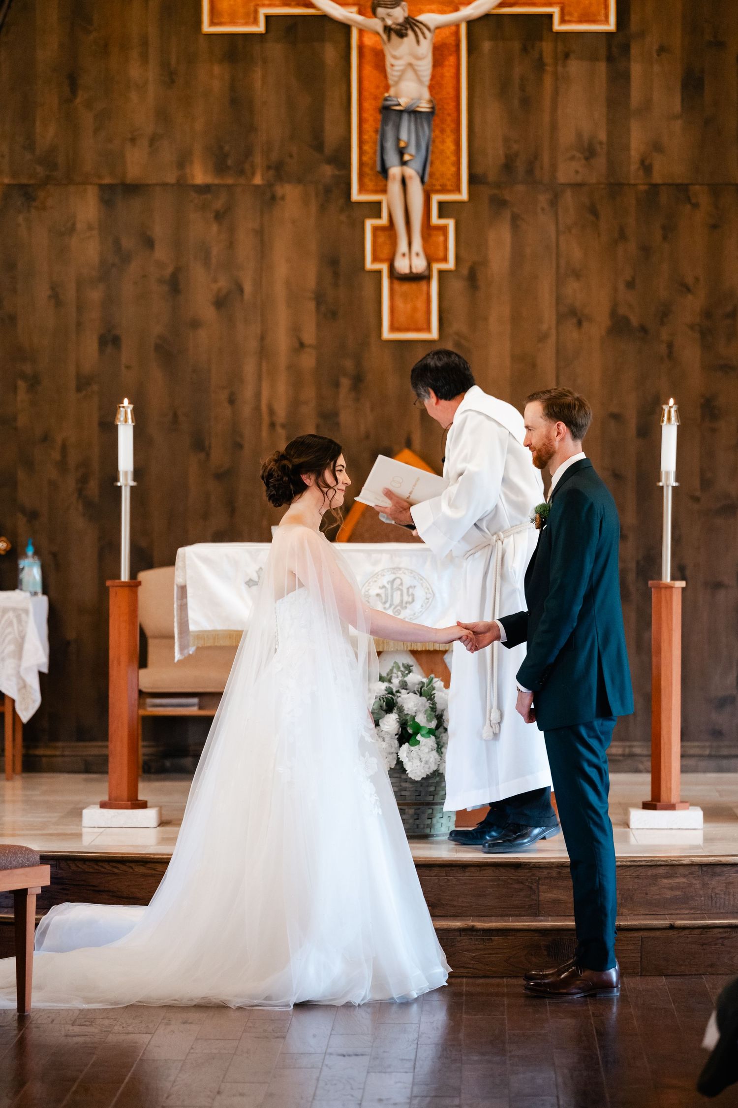 Wedding ceremony sequence showing dancing and celebration in front of a wooden cross altar.