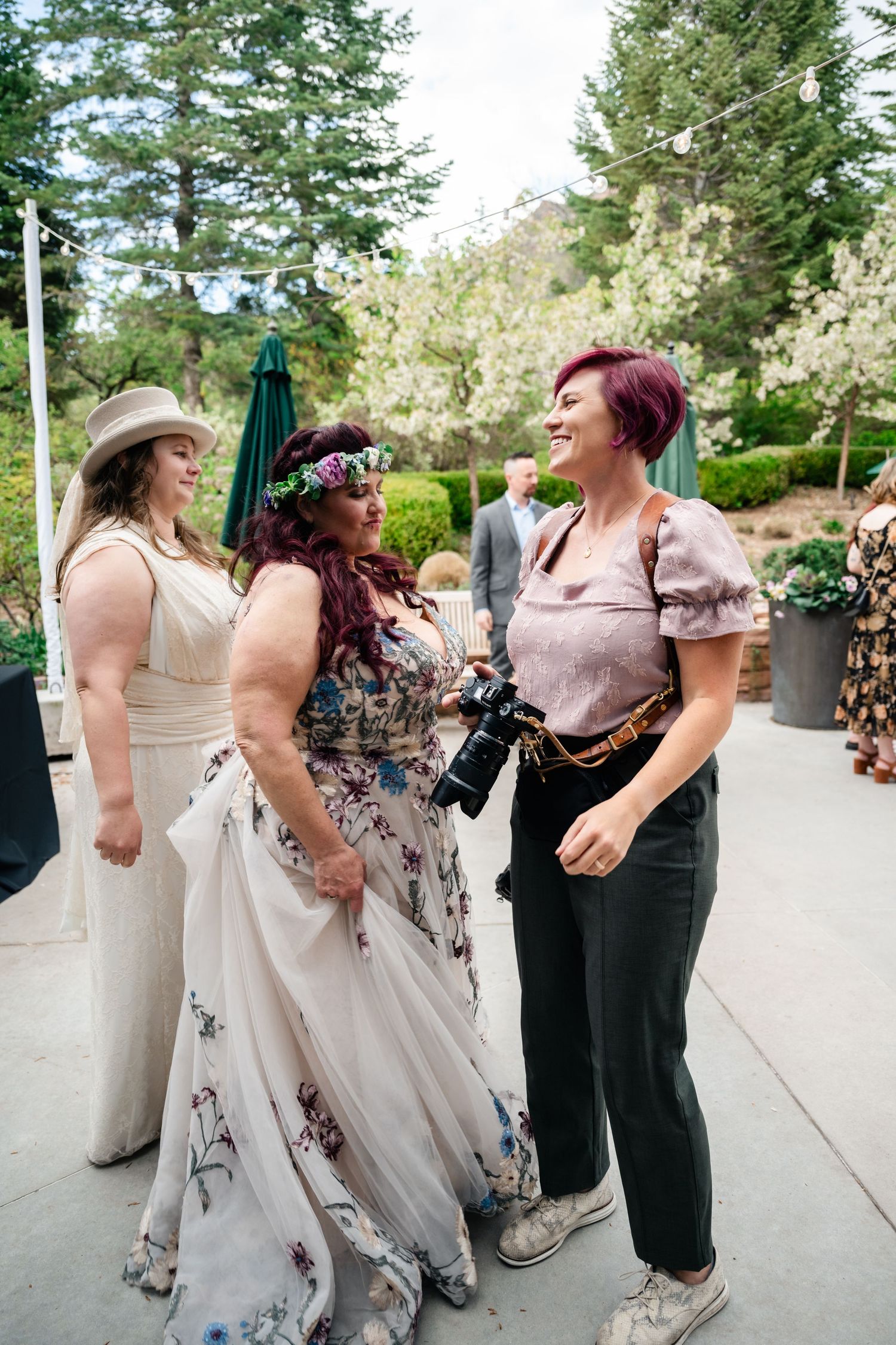 Utah Wedding Photographer laughing with her LGBTQ couple at Red Butte Gardens in SLC