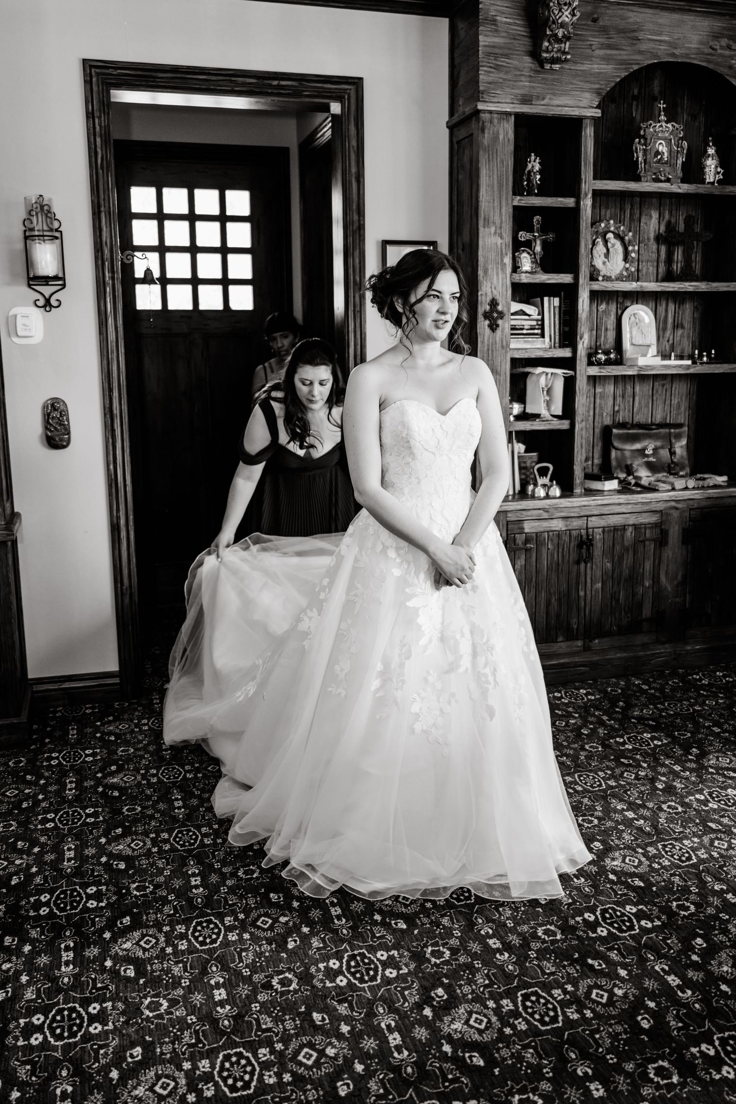 A series of black and white photos showing a bride in a flowing white wedding dress against a patterned carpet background.