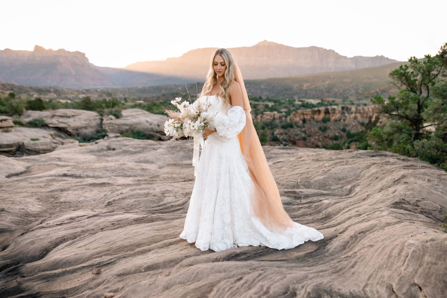 Ethereal desert sunrise bridal photoshoot captured by a Utah elopement photographer