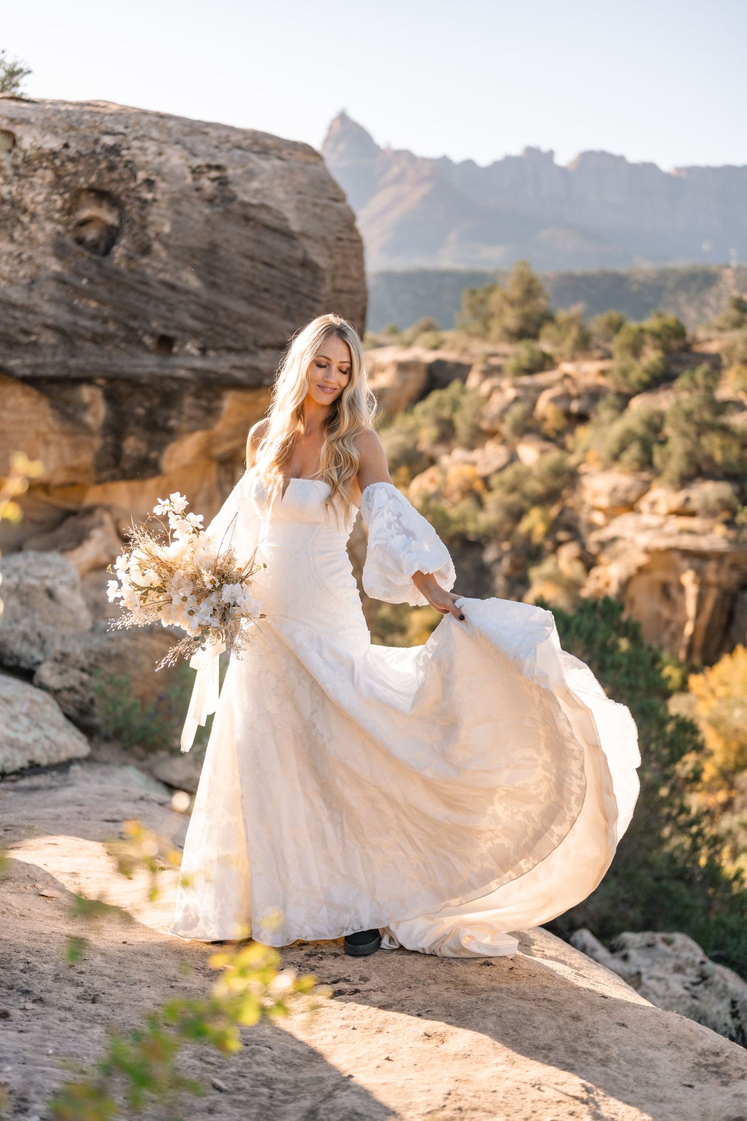Ethereal desert sunrise bridal photoshoot captured by a Utah elopement photographer