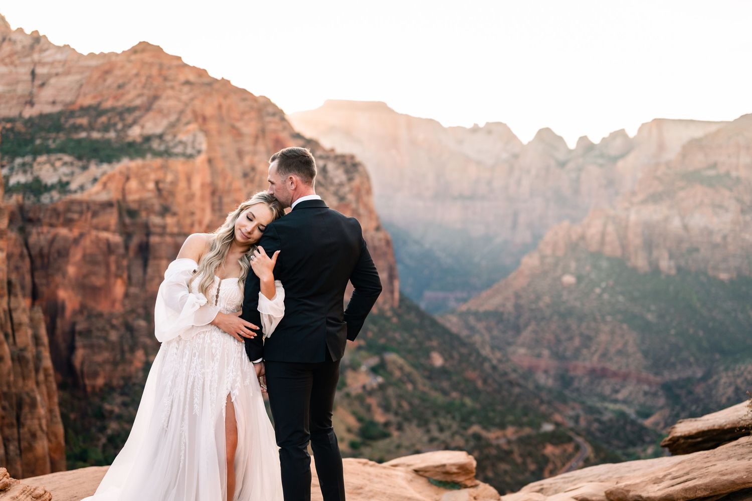Wedding portraits at the Zion Overlook at sunset by Utah Elopement Photographer