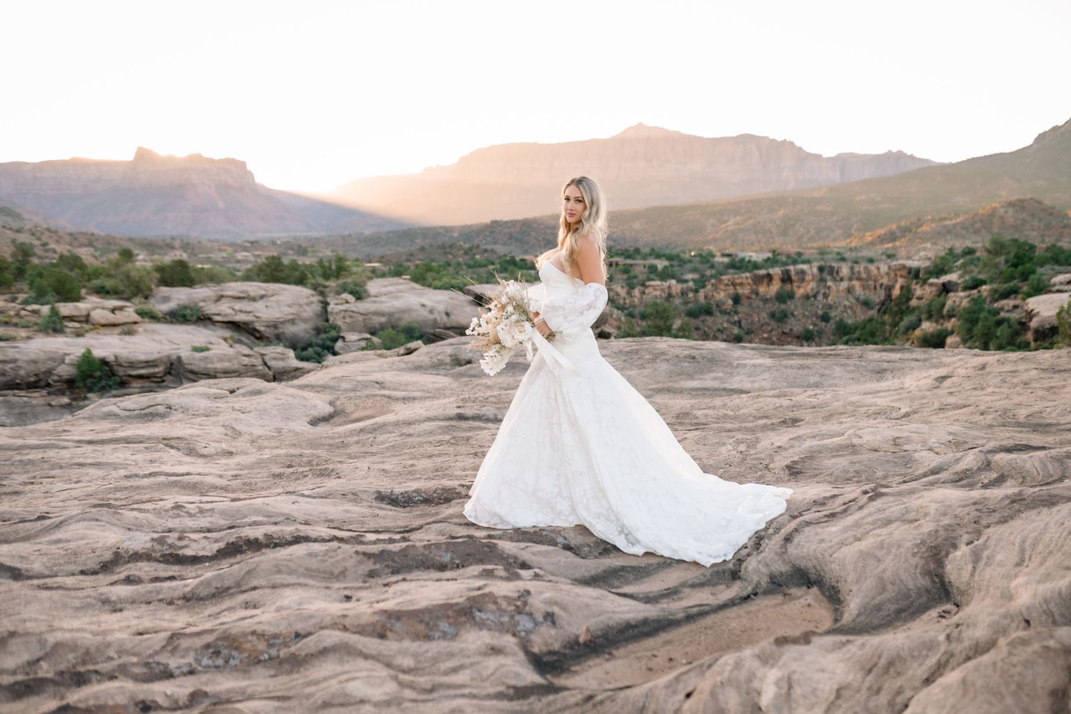 Ethereal desert sunrise bridal photoshoot captured by a Utah elopement photographer