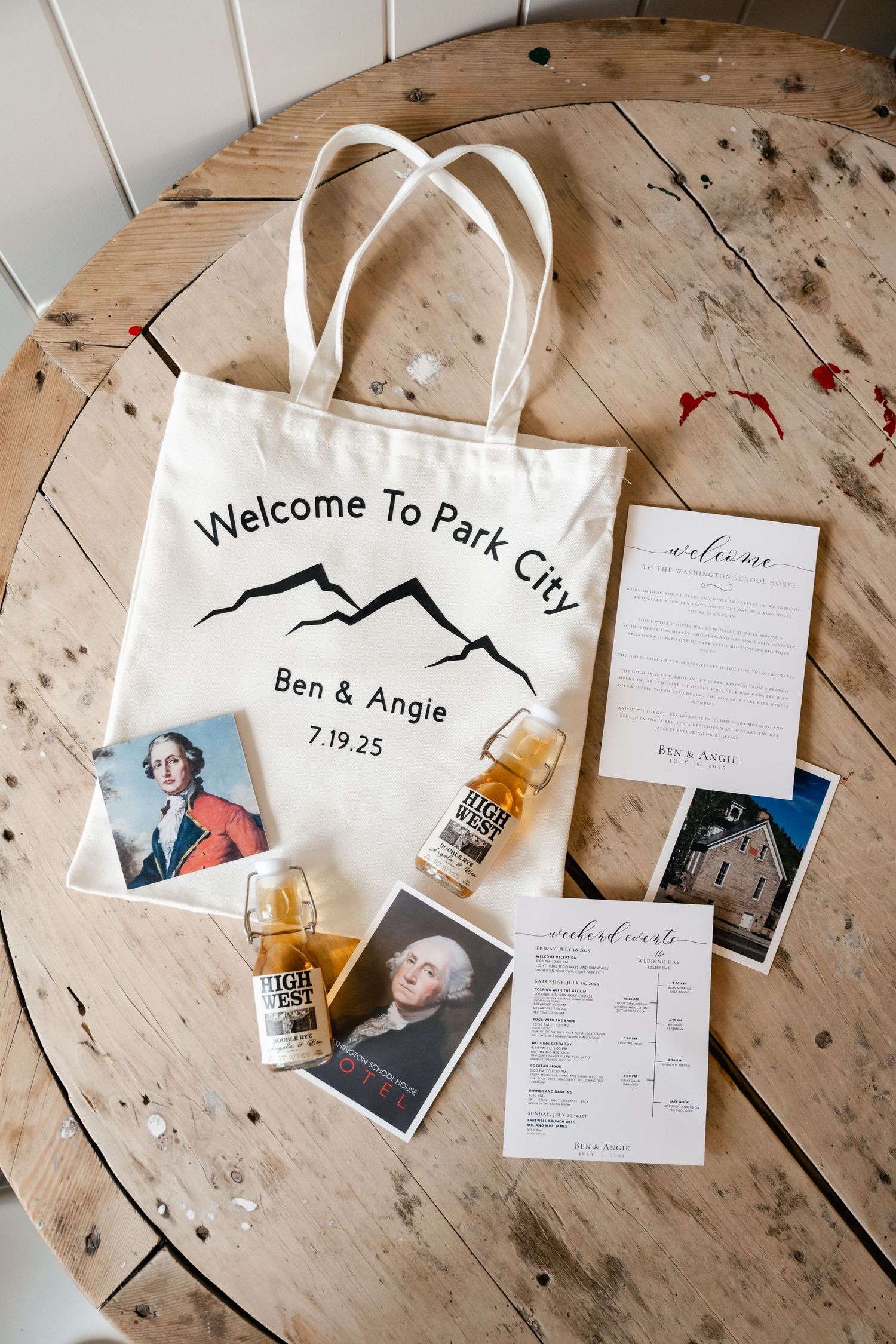 Wedding welcome bags with personalized items and itineraries laid out on rustic wooden surface.