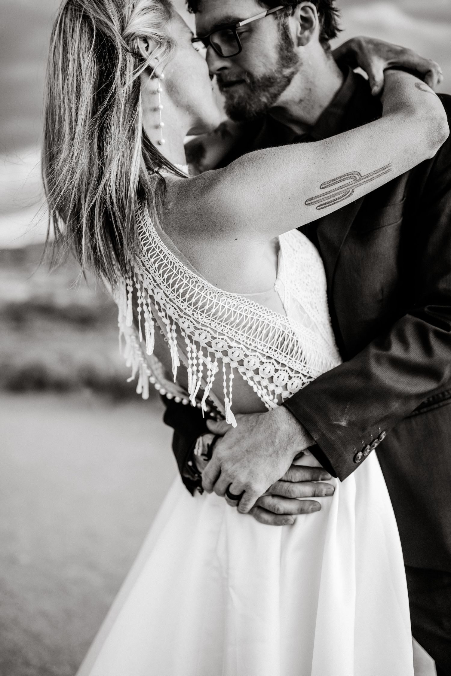 elopement couple close snuggle at Arches National Park by Utah Elopement Photographer