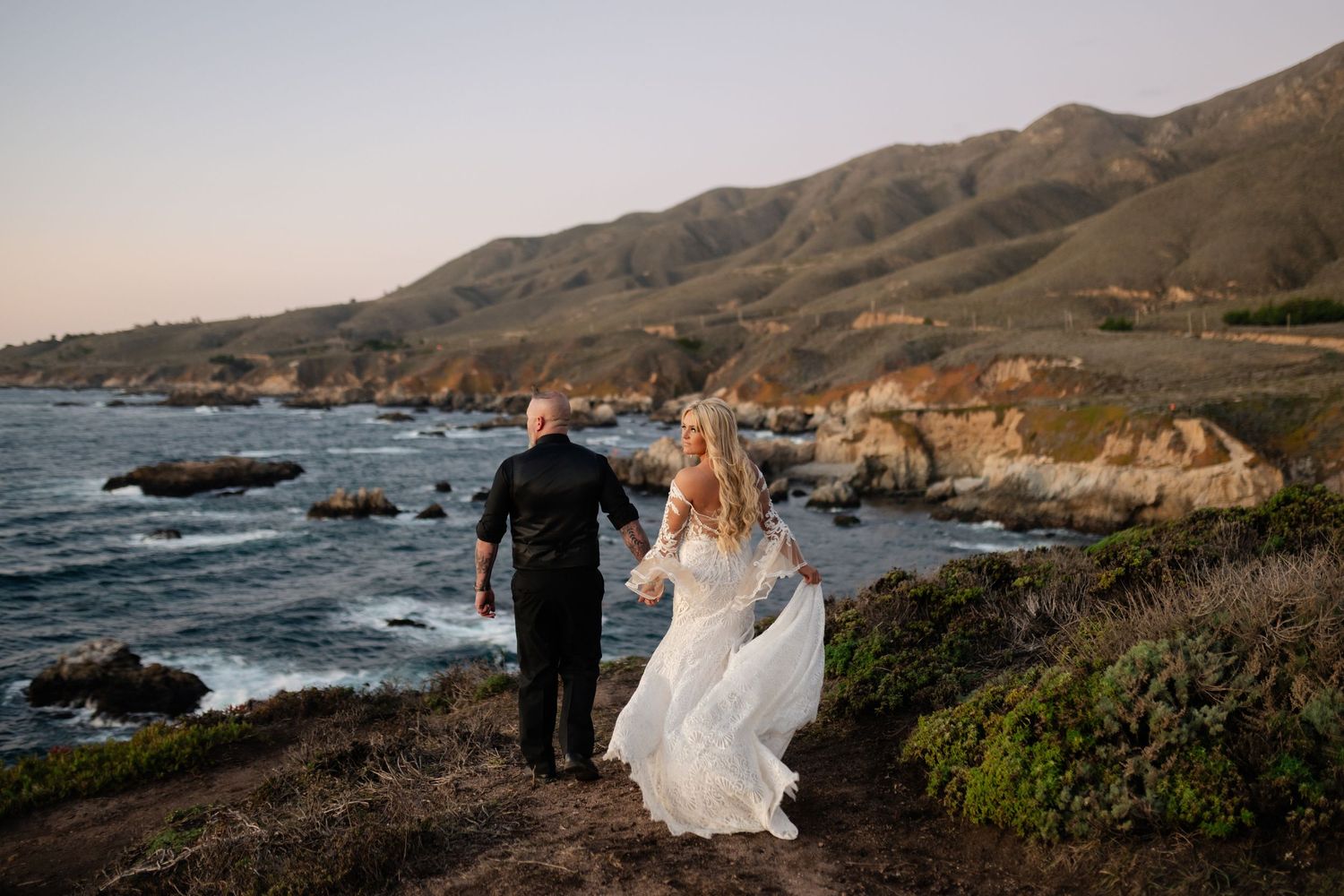 Dramatic oceanside cliffs and rocky coastline during golden hour.