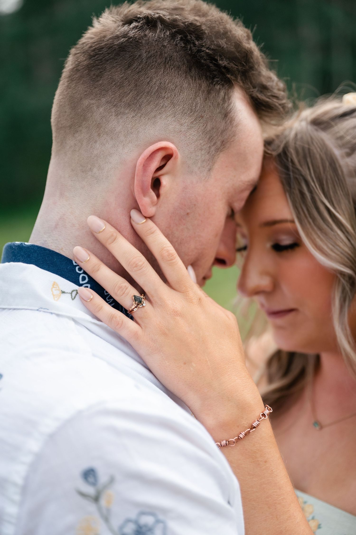 Close up of tender romantic moment between couple with soft natural lighting and intimate expressions.