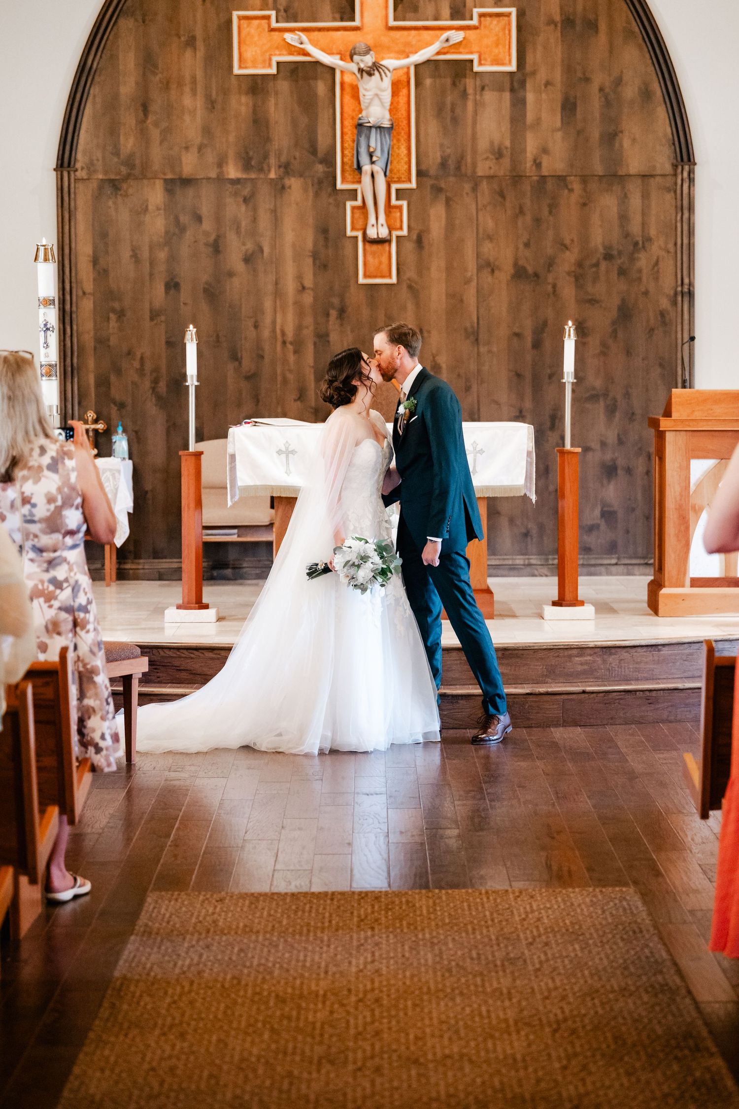 A sequence of wedding photos showing dancing and movement in a church with wooden walls and crosses.