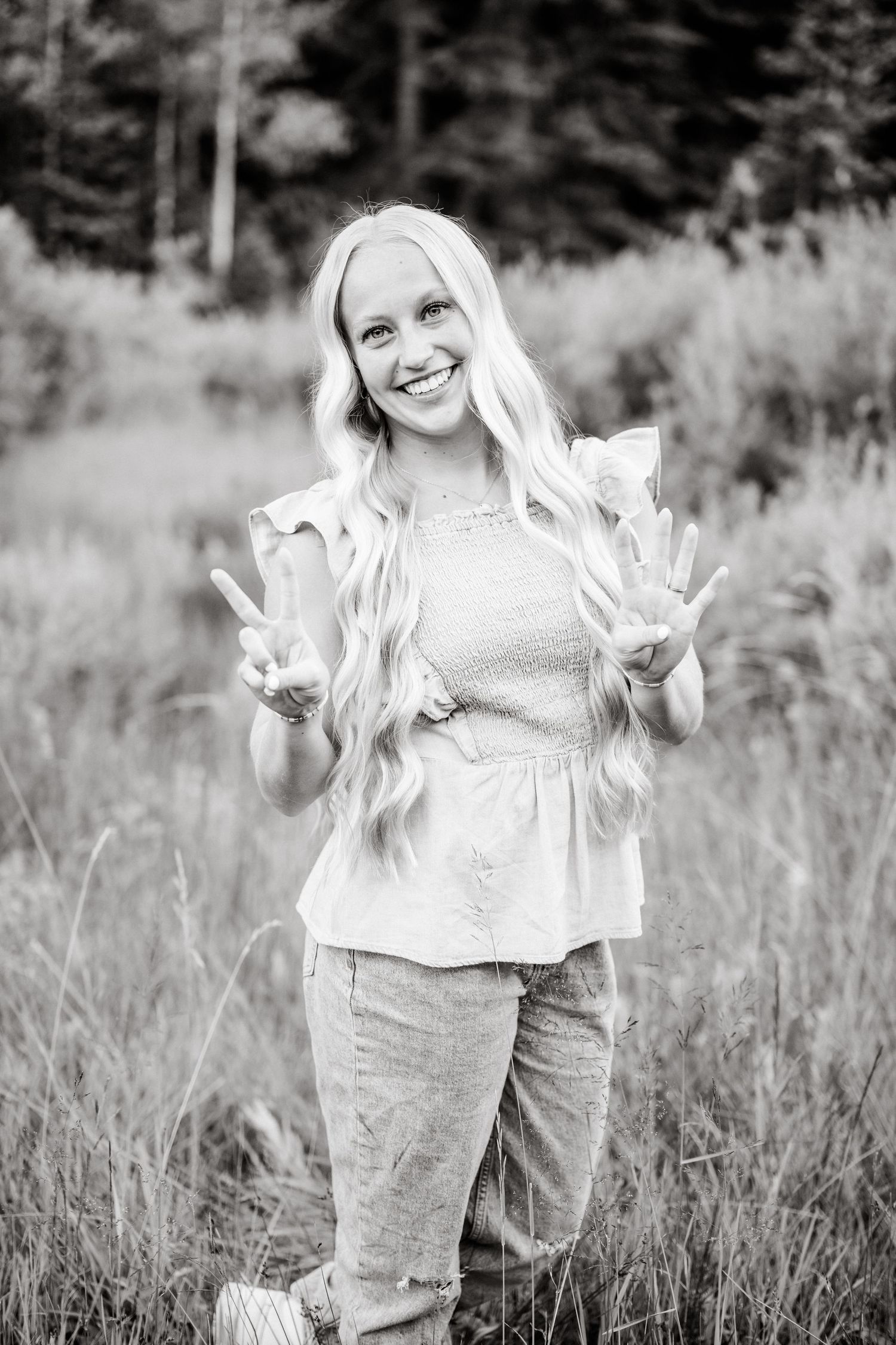 black and white smiling portrait by the creek in american fork canyon