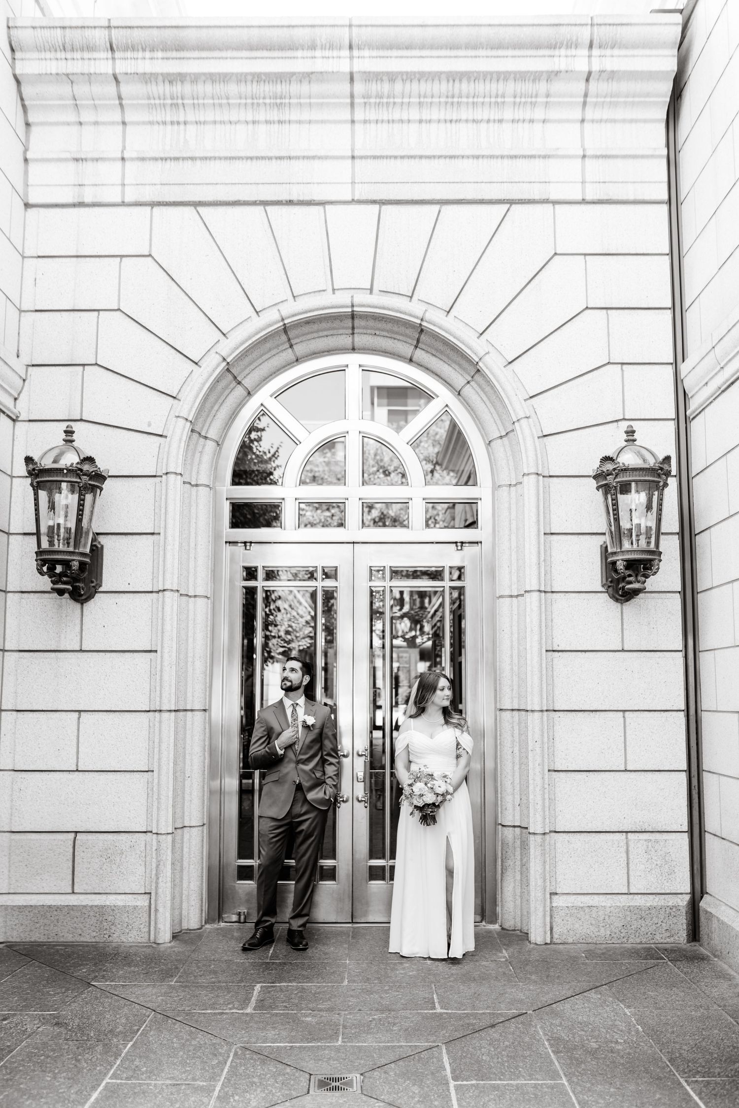 A sequence of black and white photos showing a couple posing in front of an elegant building entrance with arched doorways.