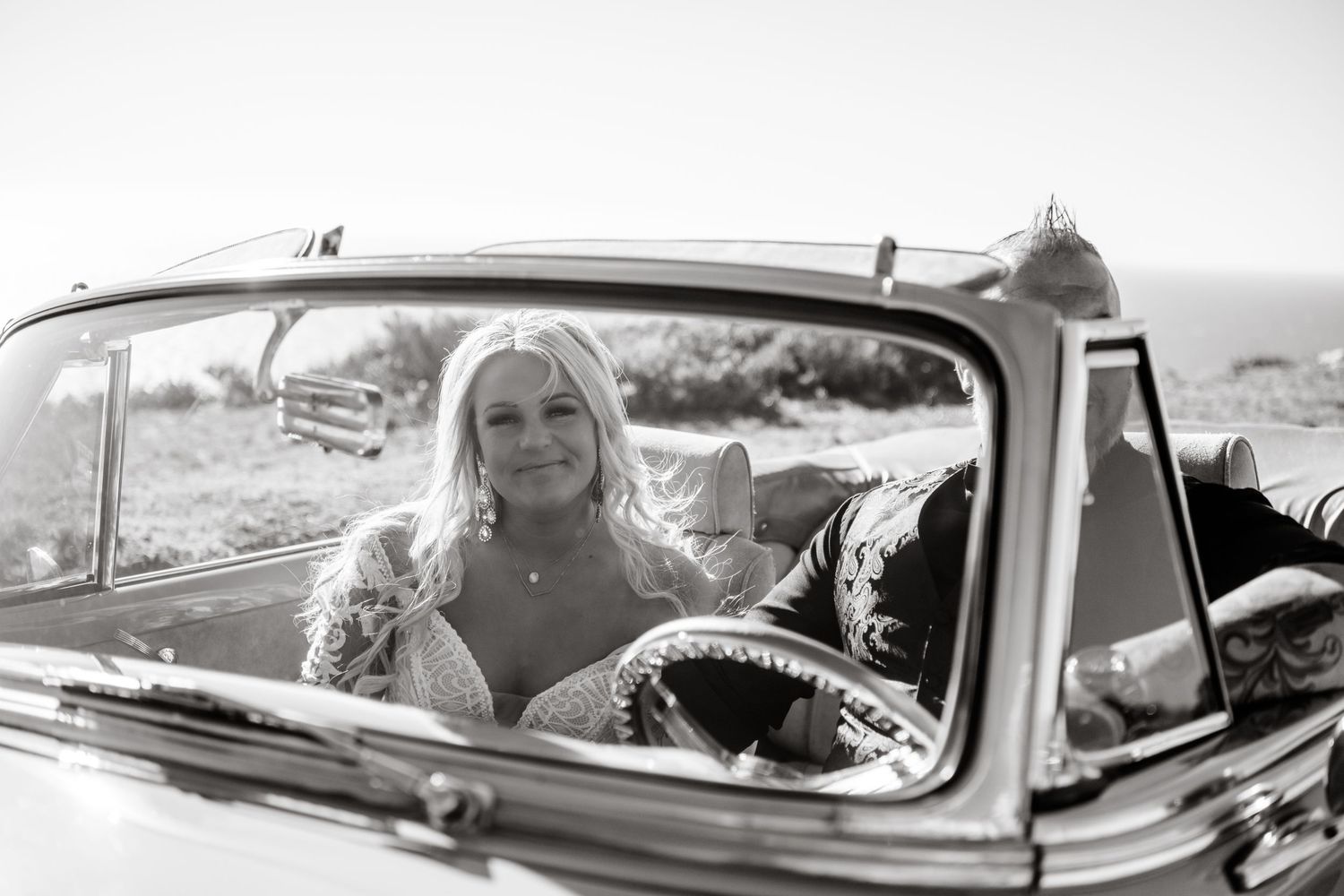 Classic vintage car wedding photos captured in black and white style.