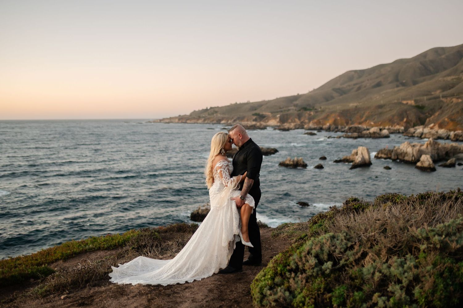 Scenic coastal wedding photos with dramatic cliffs and ocean views.