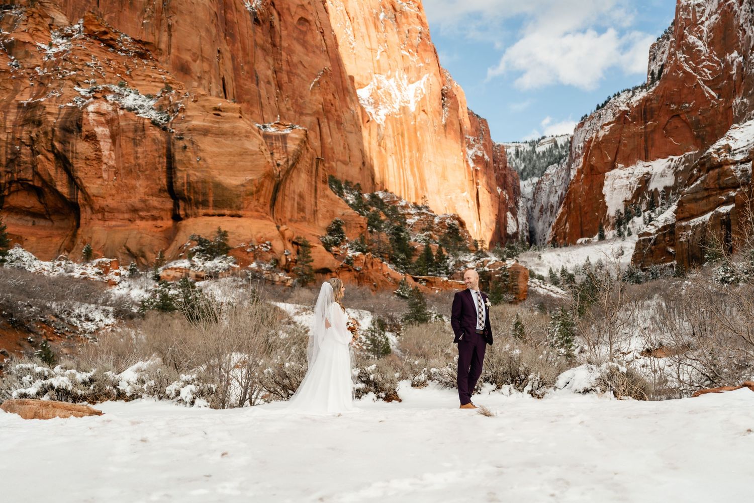 Panoramic winter scene of snow-covered red rock formations at Garden of the Gods park in Colorado Springs.