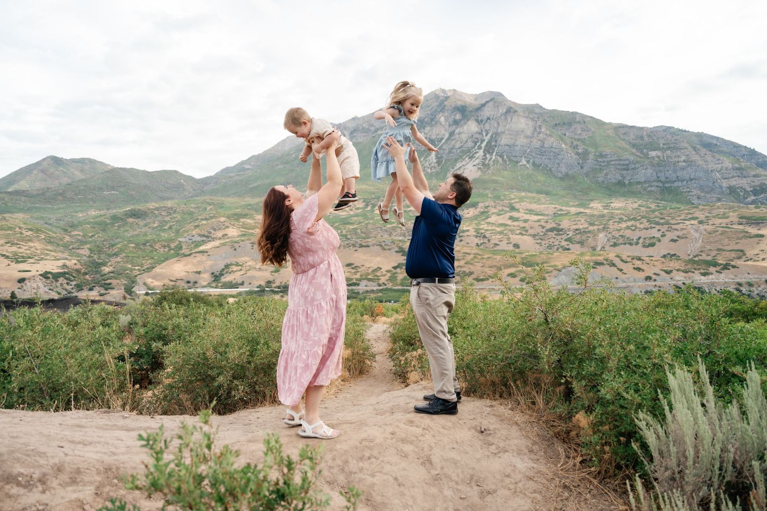 A series of photos showing people enjoying scenic mountain views and desert landscapes at different lookout points.