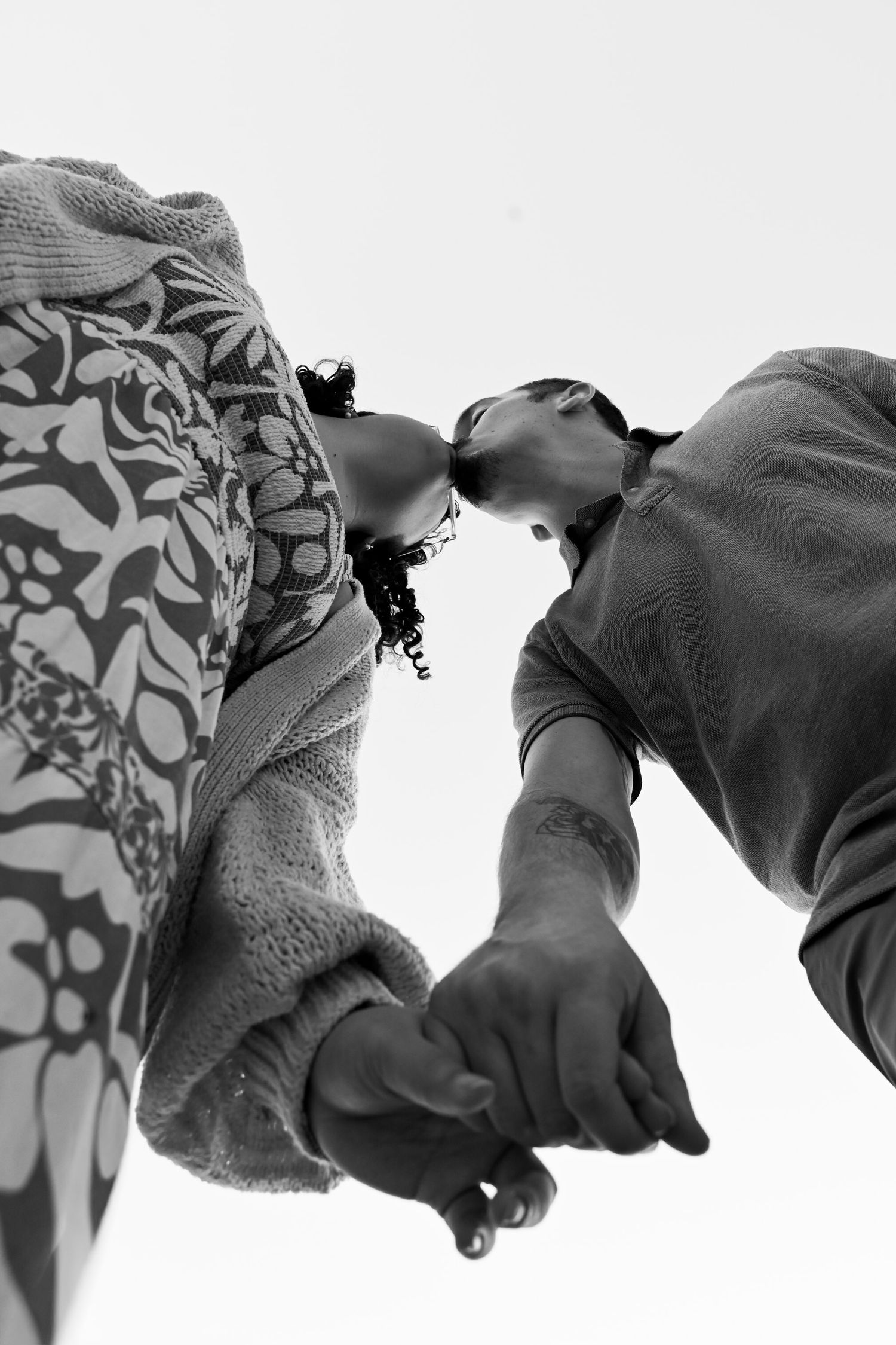 Black and white artistic photo series showing close-up details of draped fabric with abstract shadows and textures.