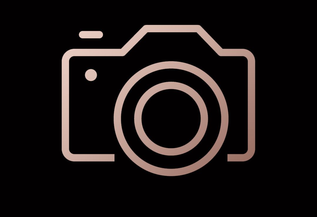 Simple camera icon design in rose gold color on black background.