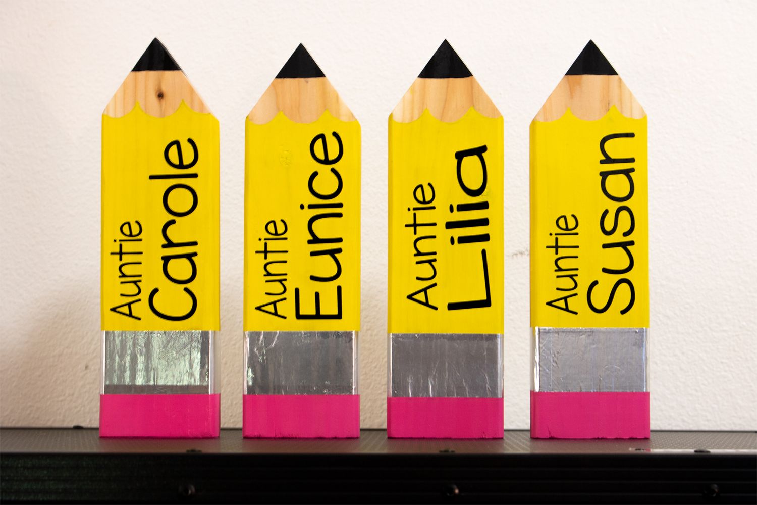 Four vinyl stickers on large decorative wooden pencils.