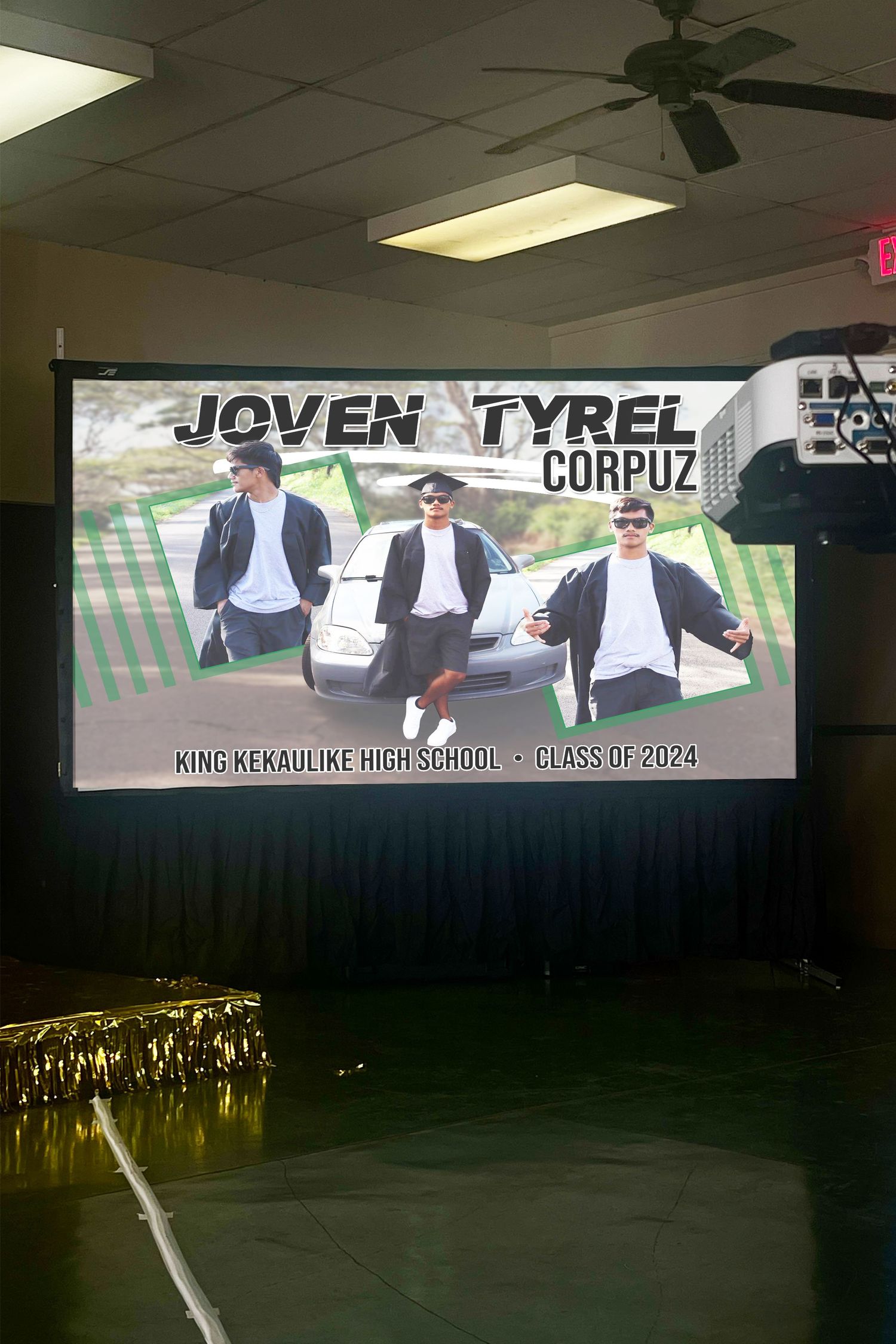 Graduation banner displayed on projector and projection screen.