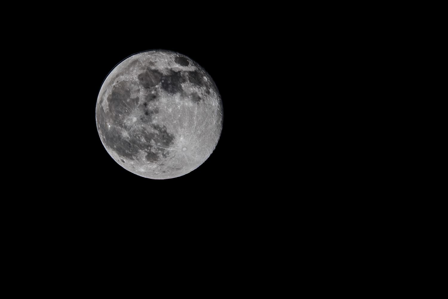 A sequence of five moon phases showing the full moon gradually decreasing in size from left to right.