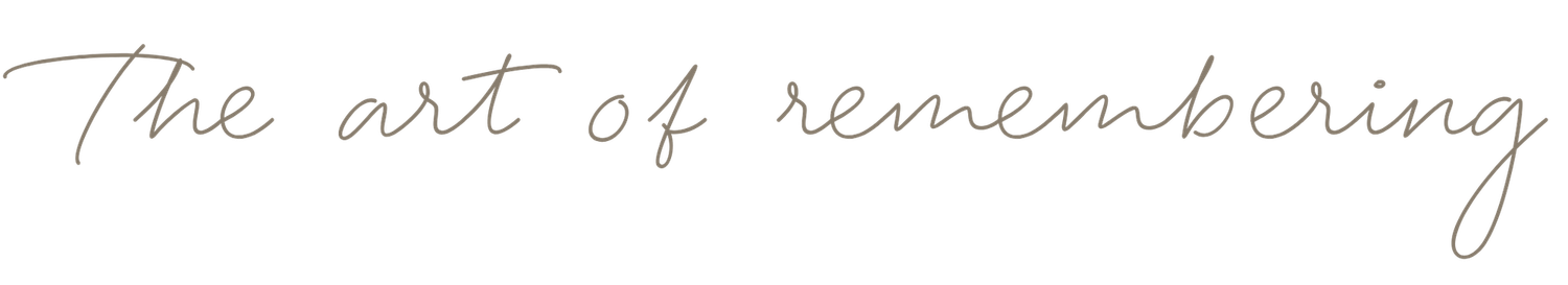 Elegant cursive script reading The Art of Remembering in delicate gray handwritten typography.