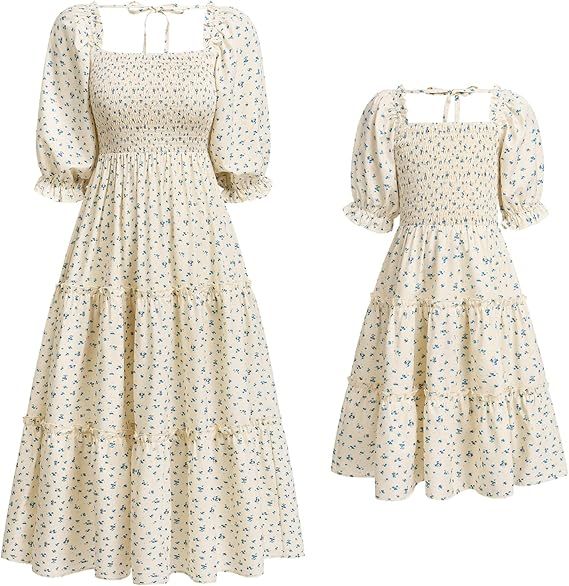 Vintage-inspired white cotton midi dress with puff sleeves and delicate floral print in smocked bodice design.