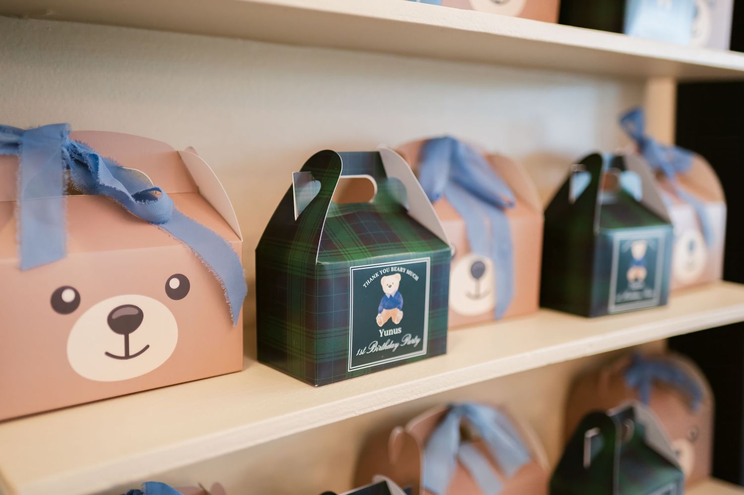 Cute animal-themed tissue box covers displayed on white shelves in a retail store setting.