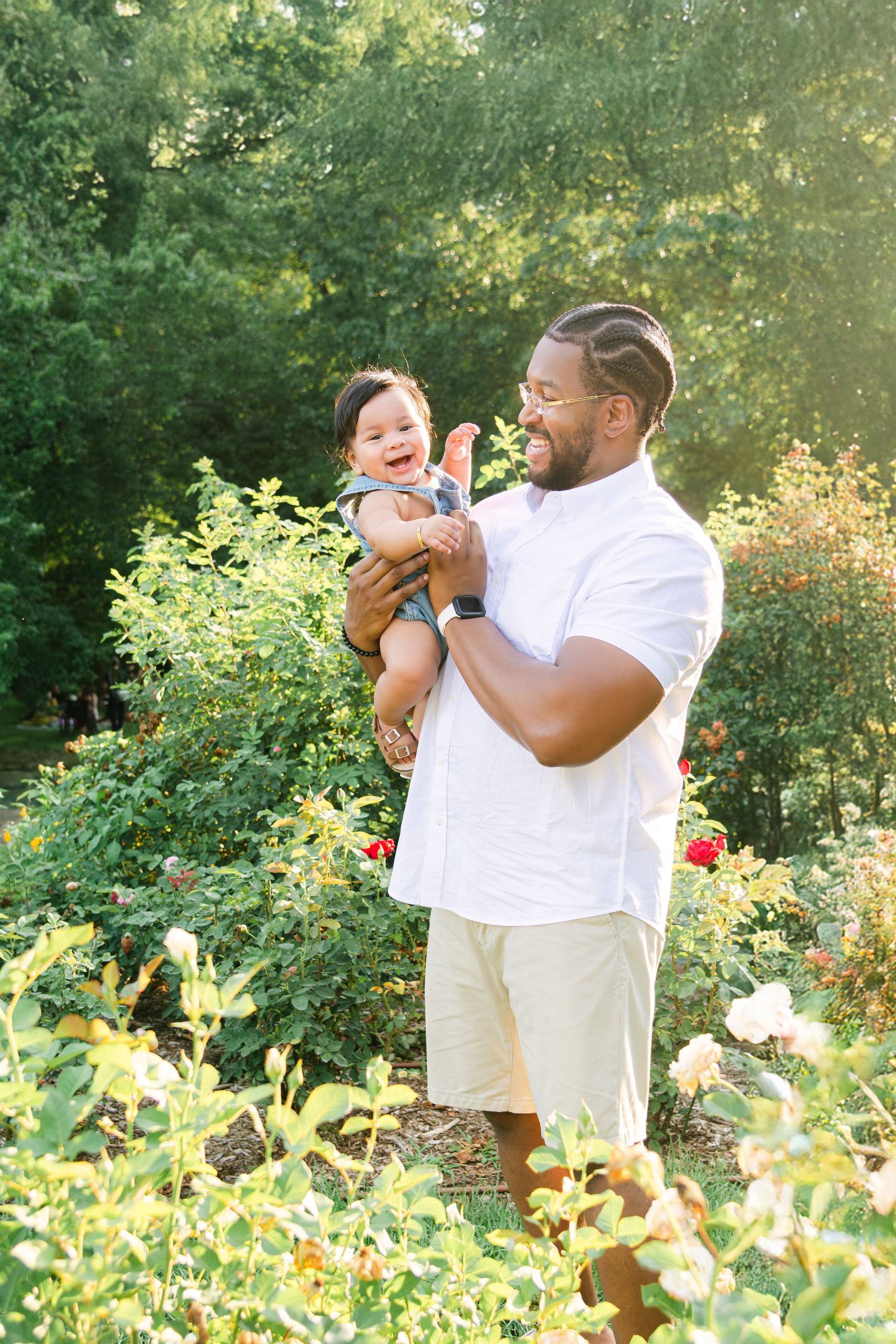 A series of candid moments in a garden setting showing joyful interactions between parent and child.