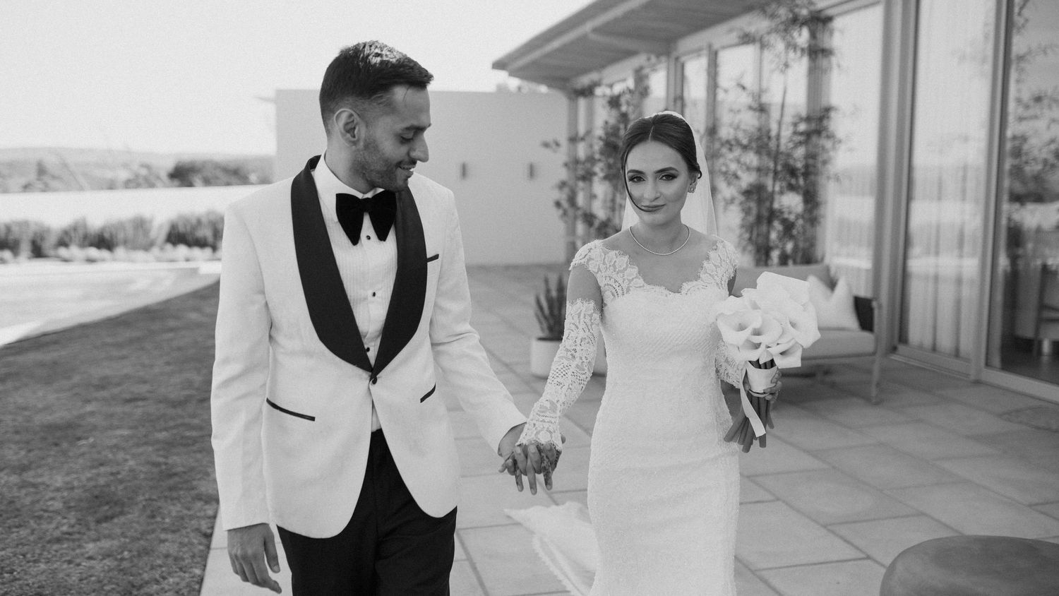 Elegant black and white wedding photography in outdoor venue.